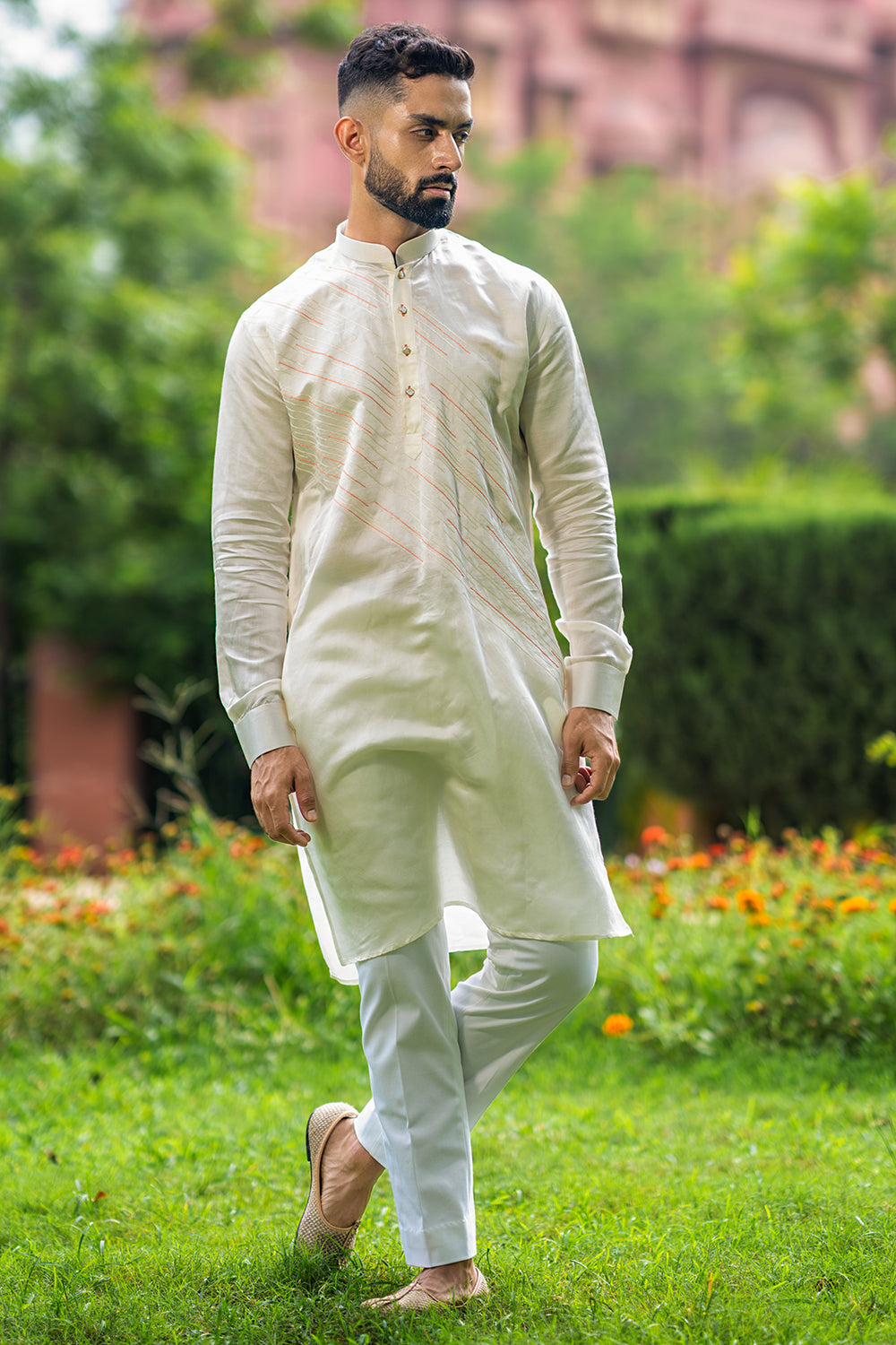 Ivory Kurta With Diagonal Orange And Ivory Threadwork Detailing