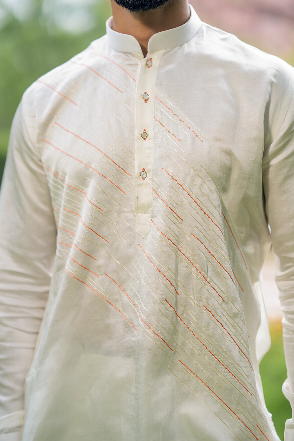 Ivory Kurta With Diagonal Orange And Ivory Threadwork Detailing