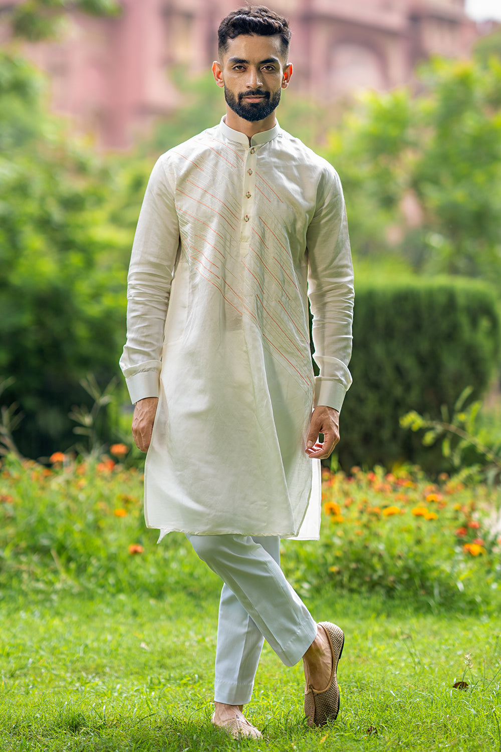 Ivory Kurta With Diagonal Orange And Ivory Threadwork Detailing